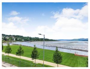a view of a river with a street light at Our Salad Days Lochgilphead in Lochgilphead