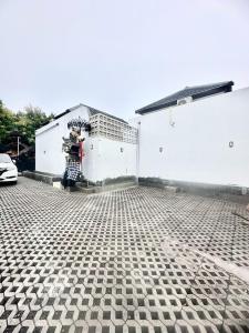a garage with a tiled floor in front of a building at Stylish Villa, 2BR ,GREAT VALUE, Great Location ! in Uluwatu