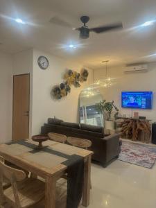 a living room with a couch and a table at Stylish Villa, 2BR ,GREAT VALUE, Great Location ! in Uluwatu