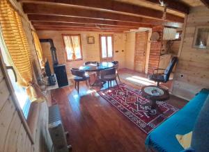 an overhead view of a living room in a log cabin at Brvnara Topilo in Niš
