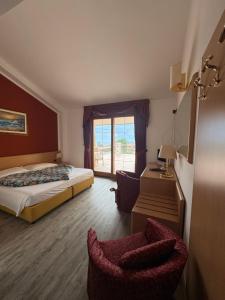 Katil atau katil-katil dalam bilik di Hotel Alpi
