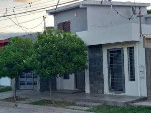 a white house with a tree in front of it at Linas Apart & Suite in La Rioja