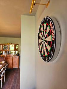 a dart board on the wall of a room at Greystonedale Mansion, A Grand Retreat in Northumberland in Haltwhistle