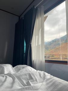 Postel nebo postele na pokoji v ubytování Bungalow Khánh Hải