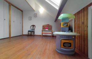 a room with a toy stove in the middle of a room at 2 Bedroom Pet Friendly Home In Treignes in Treignes