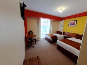 Postel nebo postele na pokoji v ubytování Hotel Munay Tambo