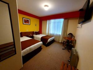 Postel nebo postele na pokoji v ubytování Hotel Munay Tambo