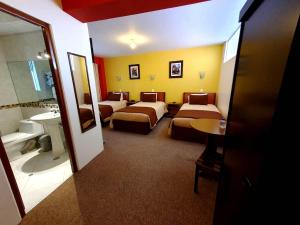Postel nebo postele na pokoji v ubytování Hotel Munay Tambo