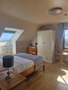 Voodi või voodid majutusasutuse Rossroe Lodge B&B toas