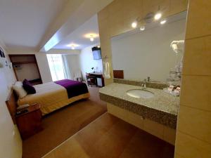 Postel nebo postele na pokoji v ubytování Hotel Munay Tambo