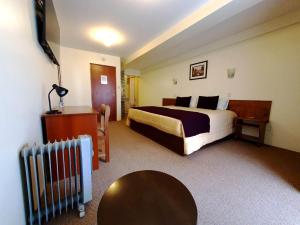 Postel nebo postele na pokoji v ubytování Hotel Munay Tambo