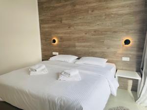 A bed or beds in a room at Z Inn Ioannina