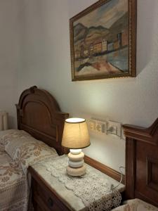 Postel nebo postele na pokoji v ubytování ALBERGUE CASA ARQUEÑA sólo peregrinos con credenciales