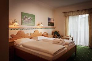 Postel nebo postele na pokoji v ubytování Landhotel Spreitzhofer