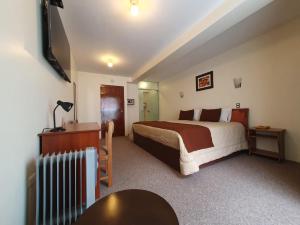 Postel nebo postele na pokoji v ubytování Hotel Munay Tambo
