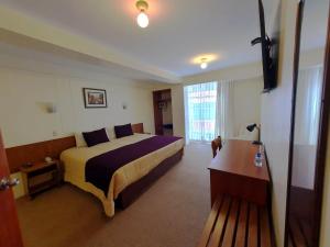 Postel nebo postele na pokoji v ubytování Hotel Munay Tambo