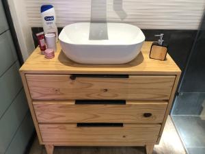 a sink on top of a wooden dresser in a bathroom at Modern, Comfy Guest Suite with Beautiful Views in Tygerberg Hills