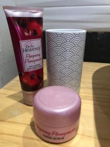 a table with a bottle and a container of cosmetics at Modern, Comfy Guest Suite with Beautiful Views in Tygerberg Hills