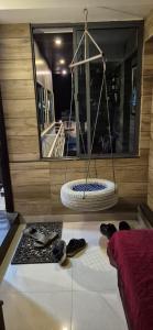 a room with a large mirror and shoes on the floor at Casa De Nazareth Homestay in Cochin +10 photos