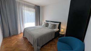 Ένα ή περισσότερα κρεβάτια σε δωμάτιο στο Appartements GIANNA