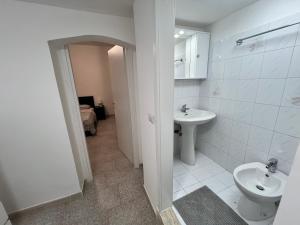 a bathroom with a sink and a toilet at Manzoni Holiday 185 in Bari