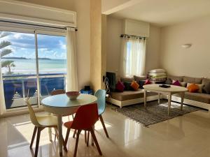 a living room with a view of the ocean at Sea view apartment Mogador in Essaouira