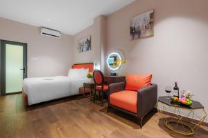 Postel nebo postele na pokoji v ubytování Salute Saigon Hotel and Spa