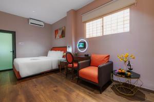 Postel nebo postele na pokoji v ubytování Salute Saigon Hotel and Spa