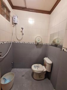a bathroom with a toilet and a sink at N2 Studio Room Apartment Transient House Ground Floor walking distance to Abreeza Mall, USEP, SM Lanang in Davao City