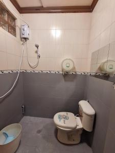 a bathroom with a toilet and a sink and a tub at N2 Studio Room Apartment Transient House Ground Floor walking distance to Abreeza Mall, USEP, SM Lanang in Davao City