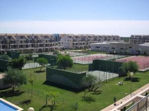 a tennis court with two tennis courts in a city at Special place to rest and enjoy in San Jorge Castellon in Sant Jordi