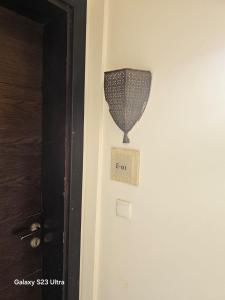 a door with a lamp on it next to a door at E01 Samarah Resort One Bedroom apartment in Sowayma
