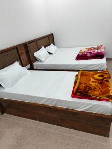 Postel nebo postele na pokoji v ubytování Hotel gora palace + 1 fotografie
