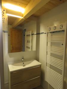 a bathroom with a sink and a mirror at Chez Maria in Corbel +22 photos