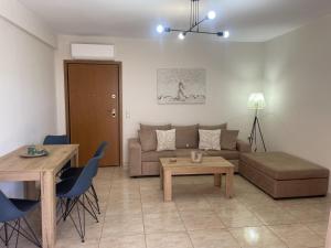 a living room with a couch and a table at Konstantino's Apartment in Monemvasia