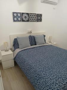 A bed or beds in a room at Albir cosy apartment