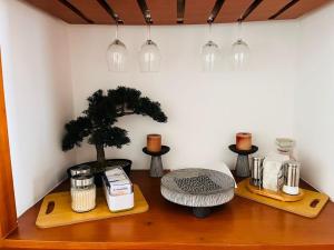 a room with a table with a tree and lights at Lindo Depto estilo vintage a una cuadra del bulevar 3er piso in Isla Sacrificios