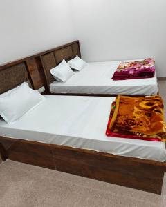 Postel nebo postele na pokoji v ubytování Hotel gora palace