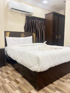 Postel nebo postele na pokoji v ubytování Majestic Pyramids Hotel