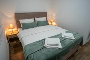 Letto o letti in una camera di Apartmani ALBION