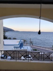 a view of the ocean from a balcony at GEOMELOS Georgios APARTMENTS CHIOS in Chios