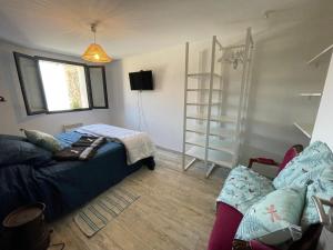 a living room with a couch and a shelf at la baumo in Sainte-Croix-de-Verdon