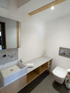 a bathroom with a sink and a toilet at Modern Eco-Lodges near Findhorn Beach in Findhorn