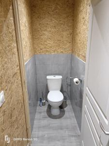 a bathroom with a white toilet in a stall at MA Loc in Aubin +9 photos