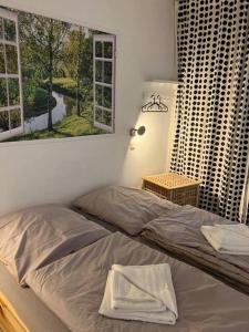 Postel nebo postele na pokoji v ubytování Oben in der 14 Etage + 1 fotografie