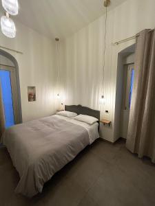 Postel nebo postele na pokoji v ubytování B&B Arco Trinità