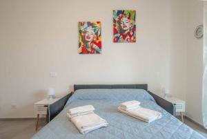 Postel nebo postele na pokoji v ubytování Marilyn - Modern and Cozy Apartment