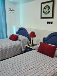 Postel nebo postele na pokoji v ubytování Hostal Casa Sifre