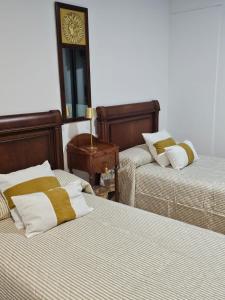 Postel nebo postele na pokoji v ubytování Hostal Casa Sifre