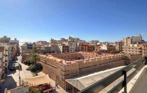 a view of a city with a brick wall at 2 Bedroom Cozy Apartment In Santa Pola in Santa Pola +21 photos